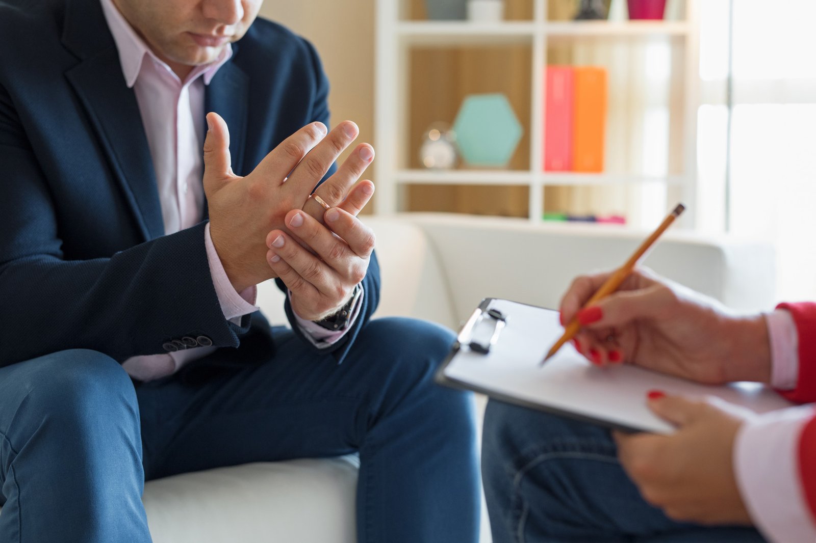 man in therapy session with psychologist